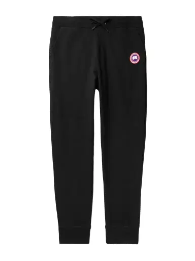 Canada Goose Huron Tapered Logo-Appliquéd Cotton-Jersey Sweatpants - Men | Thumbnail 1 Canada Goose Huron Tapered Logo-Appliquéd Cotton-Jersey Sweatpants - Men | Thumbnail 1