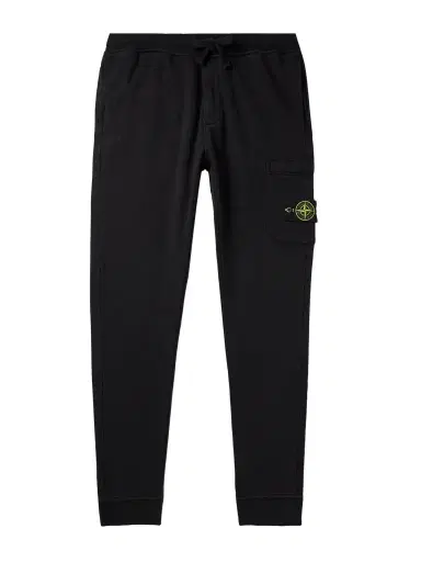 Stone Island Tapered Logo-Appliquéd Garment-Dyed Cotton-Jersey Sweatpants - Men | Thumbnail 1 Stone Island Tapered Logo-Appliquéd Garment-Dyed Cotton-Jersey Sweatpants - Men | Thumbnail 1