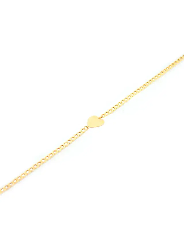 14KY Gold curb Link Bracelet whit heart. _7" inches with jump ring at 6 1/2"