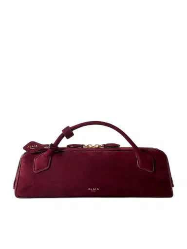 Alaïa Le Teckel Leather-trimmed Suede Clutch | Thumbnail 1 Alaïa Le Teckel Leather-trimmed Suede Clutch | Thumbnail 1