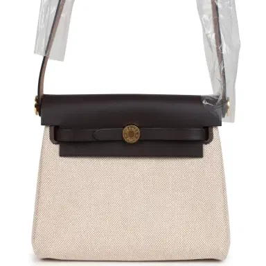 HERMÈS Hermes Herbag Zip 20 Mini Ecru and Beige Toile H Canvas and Ebene Vache Hunter Gold Hardware | Thumbnail 1 HERMÈS Hermes Herbag Zip 20 Mini Ecru and Beige Toile H Canvas and Ebene Vache Hunter Gold Hardware | Thumbnail 1
