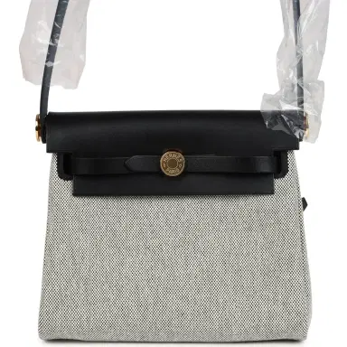 HERMÈS Hermes Herbag Zip 20 Mini Ecru and Black Toile H Canvas and Black Vache Hunter Gold Hardware | Thumbnail 1 HERMÈS Hermes Herbag Zip 20 Mini Ecru and Black Toile H Canvas and Black Vache Hunter Gold Hardware | Thumbnail 1