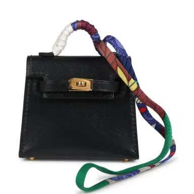 HERMÈS Hermes Mini Kelly Twilly Bag Charm Black Tadelakt Gold Hardware | Thumbnail 1 HERMÈS Hermes Mini Kelly Twilly Bag Charm Black Tadelakt Gold Hardware | Thumbnail 1