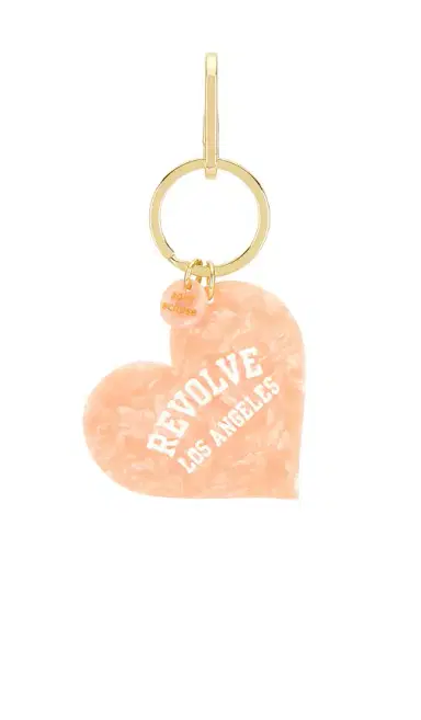 Solar Eclipse x Revolve Hand-Painted Los Angeles Collegiate Heart Bag Charm + Keychain | Thumbnail 1 Solar Eclipse x Revolve Hand-Painted Los Angeles Collegiate Heart Bag Charm + Keychain | Thumbnail 1