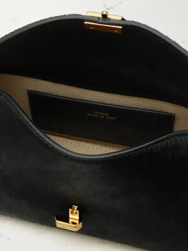 TOTEME T-lock Mini Calf Hair Clutch | Thumbnail 5 TOTEME T-lock Mini Calf Hair Clutch | Thumbnail 5