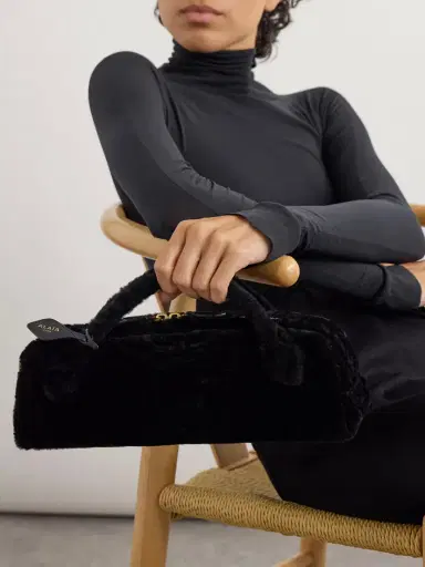 Alaïa Le Teckel Leather-trimmed Shearling Clutch | Thumbnail 2 Alaïa Le Teckel Leather-trimmed Shearling Clutch | Thumbnail 2