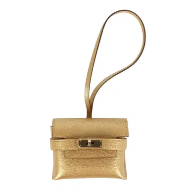 HERMÈS Hermes Kelly Festival Bag Charm Dore Chevre Chamkilight Permabrass Hardware | Thumbnail 1 HERMÈS Hermes Kelly Festival Bag Charm Dore Chevre Chamkilight Permabrass Hardware | Thumbnail 1