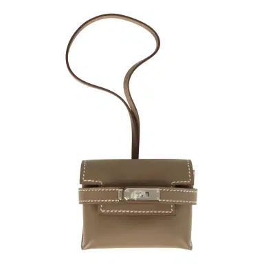 HERMÈS Hermes Kelly Festival Bag Charm Etoupe Swift Palladium Hardware | Thumbnail 1 HERMÈS Hermes Kelly Festival Bag Charm Etoupe Swift Palladium Hardware | Thumbnail 1