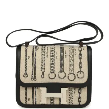 HERMÈS Pre-owned Hermes Constance 24 Toile De Camp Déchaînée and Black Swift Palladium Hardware | Thumbnail 1 HERMÈS Pre-owned Hermes Constance 24 Toile De Camp Déchaînée and Black Swift Palladium Hardware | Thumbnail 1