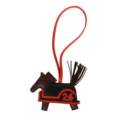 HERMÈS Hermes Rodeo Robeo 24 Charm PM Terre, Black and Rouge Radieux Milo Lambskin | Thumbnail 1