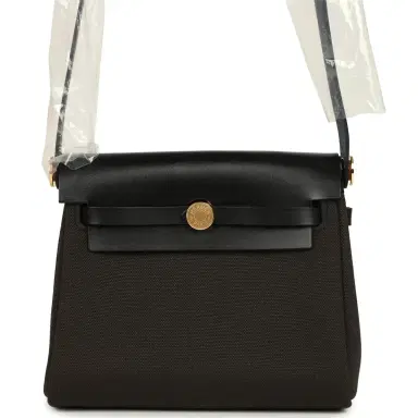 HERMÈS Hermes Herbag Zip 20 Mini Dark Bronze Toile Militaire Canvas and Black Vache Hunter Gold Hardware | Thumbnail 1 HERMÈS Hermes Herbag Zip 20 Mini Dark Bronze Toile Militaire Canvas and Black Vache Hunter Gold Hardware | Thumbnail 1