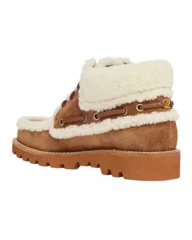 Valentino Garavani Palm Avenue Desert Goat Shearling Booties | Thumbnail 1 Valentino Garavani Palm Avenue Desert Goat Shearling Booties | Thumbnail 1