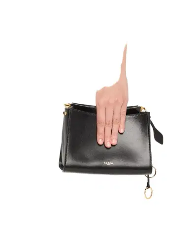 Alaïa Le Click Small Square Shoulder Bag in Glossy Leather | Thumbnail 1 Alaïa Le Click Small Square Shoulder Bag in Glossy Leather | Thumbnail 1