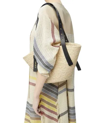Loewe x Paula's Ibiza Punch Hole Small Basket Shoulder Bag in Raffia | Thumbnail 1 Loewe x Paula's Ibiza Punch Hole Small Basket Shoulder Bag in Raffia | Thumbnail 1