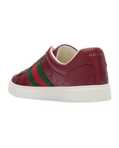 Gucci Men's Ace GG Embossed Leather Low-Top Sneakers | Thumbnail 1 Gucci Men's Ace GG Embossed Leather Low-Top Sneakers | Thumbnail 1