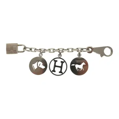 HERMÈS Pre-owned Hermes Breloque Olga Bag Charm Palladium Hardware | Thumbnail 1 HERMÈS Pre-owned Hermes Breloque Olga Bag Charm Palladium Hardware | Thumbnail 1