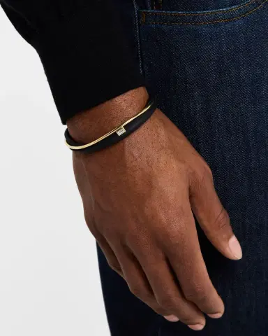 Nikos Koulis ME+N 18K Yellow Gold and Aluminum Tapered Diamond Bangle Bracelet | Thumbnail 1 Nikos Koulis ME+N 18K Yellow Gold and Aluminum Tapered Diamond Bangle Bracelet | Thumbnail 1