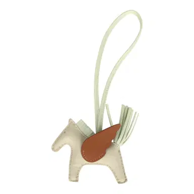 HERMÈS Hermes Pegase Rodeo Bag Charm PM Vert Fizz, Craie & Gold Milo Lambskin | Thumbnail 1 HERMÈS Hermes Pegase Rodeo Bag Charm PM Vert Fizz, Craie & Gold Milo Lambskin | Thumbnail 1