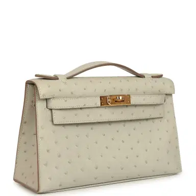 HERMÈS Hermes Kelly Pochette Gris Perle Ostrich Gold Hardware | Thumbnail 2 HERMÈS Hermes Kelly Pochette Gris Perle Ostrich Gold Hardware | Thumbnail 2