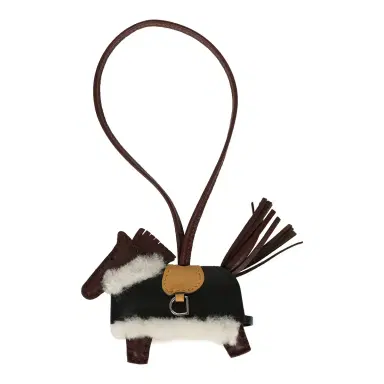 HERMÈS Hermes Rodeo Robeo Plush Charm PM Terre, Sesame, Black Milo Lambskin and Ecru Merino Wool Palladium Hardware | Thumbnail 1 HERMÈS Hermes Rodeo Robeo Plush Charm PM Terre, Sesame, Black Milo Lambskin and Ecru Merino Wool Palladium Hardware | Thumbnail 1