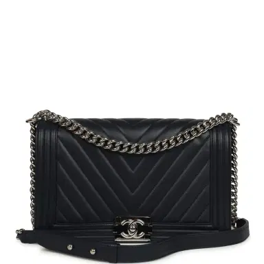 Chanel Pre-owned Chanel New Medium Chevron Boy Bag Navy Blue Calfskin Silver Hardware | Thumbnail 1 Chanel Pre-owned Chanel New Medium Chevron Boy Bag Navy Blue Calfskin Silver Hardware | Thumbnail 1