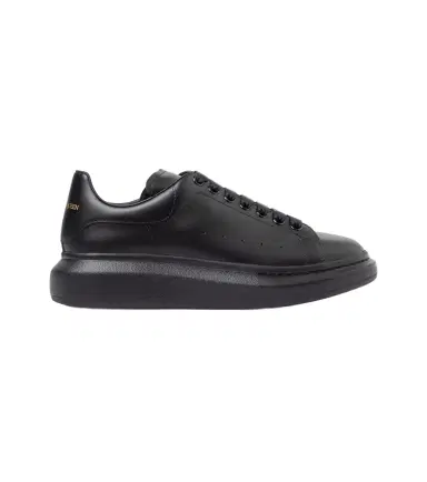 Alexander McQueen Oversized leather sneakers | Thumbnail 1 Alexander McQueen Oversized leather sneakers | Thumbnail 1