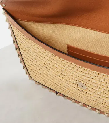 Valentino Garavani Rockstud Large leather-trimmed raffia clutch | Thumbnail 3