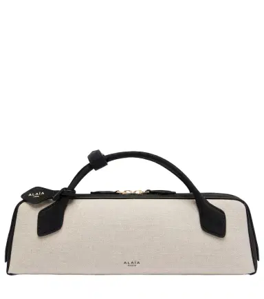 Alaïa Alaïa Le Teckel canvas clutch | Thumbnail 1 Alaïa Alaïa Le Teckel canvas clutch | Thumbnail 1