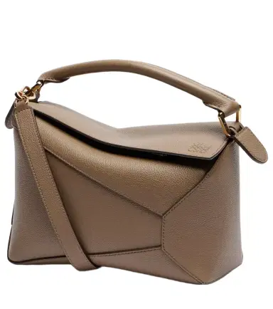 Loewe Puzzle Edge Small leather top-handle bag | Thumbnail 1 Loewe Puzzle Edge Small leather top-handle bag | Thumbnail 1