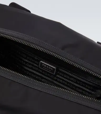 Prada Re-Nylon leather-trimmed duffel bag | Thumbnail 2 Prada Re-Nylon leather-trimmed duffel bag | Thumbnail 2