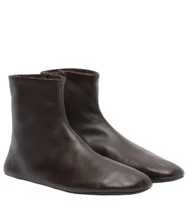 The Row Stella shearling-lined leather ankle boots | Thumbnail 1 The Row Stella shearling-lined leather ankle boots | Thumbnail 1