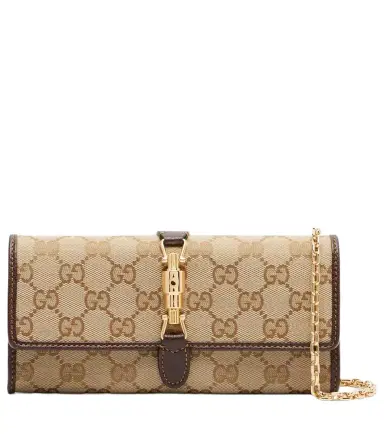 Gucci Jackie GG Canvas clutch | Thumbnail 1 Gucci Jackie GG Canvas clutch | Thumbnail 1