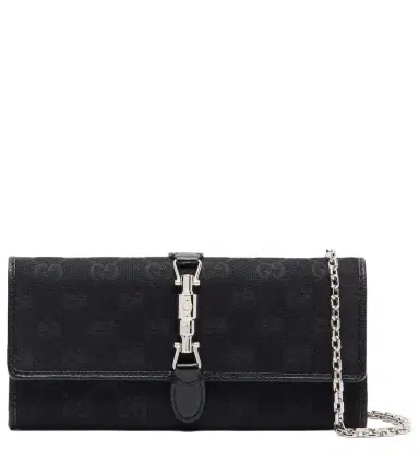 Gucci Jackie GG Canvas clutch | Thumbnail 1 Gucci Jackie GG Canvas clutch | Thumbnail 1