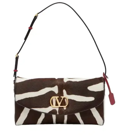 Valentino Garavani DeVain zebra-print calf hair shoulder bag | Thumbnail 1 Valentino Garavani DeVain zebra-print calf hair shoulder bag | Thumbnail 1
