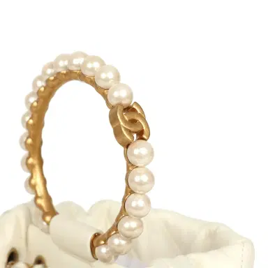 Chanel Pre-owned Chanel Mini Pearl Top Handle Bucket Bag White Calfskin Antique Gold Hardware | Thumbnail 7 Chanel Pre-owned Chanel Mini Pearl Top Handle Bucket Bag White Calfskin Antique Gold Hardware | Thumbnail 7