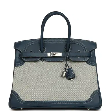 HERMÈS Pre-owned Hermes Birkin Ghillies 35 Bleu De Prusse Swift and Ecru Toile H Palladium Hardware | Thumbnail 1 HERMÈS Pre-owned Hermes Birkin Ghillies 35 Bleu De Prusse Swift and Ecru Toile H Palladium Hardware | Thumbnail 1