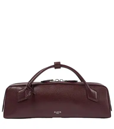 Alaïa Alaïa Le Teckel leather clutch | Thumbnail 1 Alaïa Alaïa Le Teckel leather clutch | Thumbnail 1