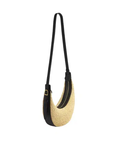 Khaite Small Augustina Crossbody Bag In Natural Raffia And Black Leather | Thumbnail 1 Khaite Small Augustina Crossbody Bag In Natural Raffia And Black Leather | Thumbnail 1