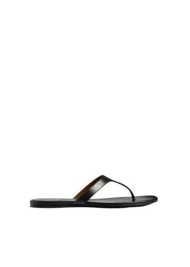 Khaite Archer Flat Sandal In Black Leather | Thumbnail 1 Khaite Archer Flat Sandal In Black Leather | Thumbnail 1