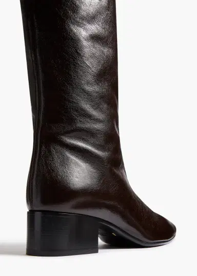 Khaite Andee Knee-High Boot In Black Glazed Leather | Thumbnail 3