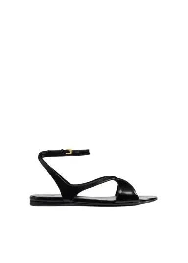Khaite Liria Ankle Strap Flat Sandal In Black Glazed Leather | Thumbnail 1 Khaite Liria Ankle Strap Flat Sandal In Black Glazed Leather | Thumbnail 1