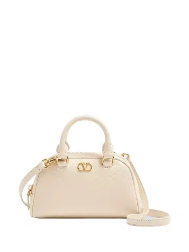 Valentino Garavani Women's VLogo Signature Mini Bowling Bag in Grainy Calfskin - Light Ivory | Thumbnail 1 Valentino Garavani Women's VLogo Signature Mini Bowling Bag in Grainy Calfskin - Light Ivory | Thumbnail 1