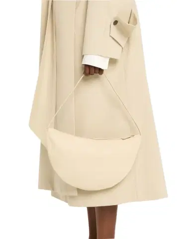 The Row Izzy Small Crescent Shoulder Bag in Leather | Thumbnail 1 The Row Izzy Small Crescent Shoulder Bag in Leather | Thumbnail 1