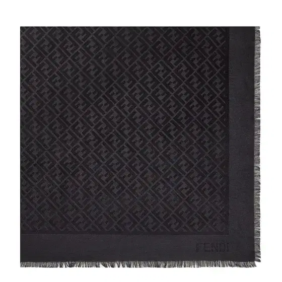The iconic shawl is made of a black wool and organic