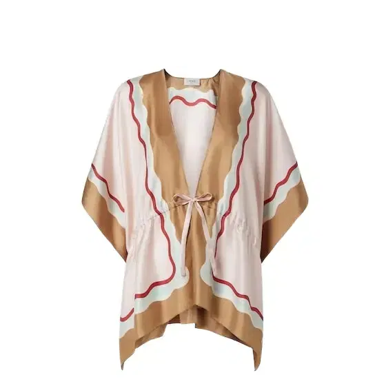 Short poncho with drawstring waist and ribbons to tie at
