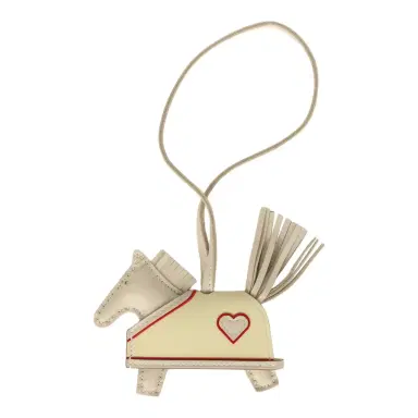 HERMÈS Hermes Rodeo Robeo Coeur Charm PM Craie, Jaune Milton & Rouge Radieux Milo Lambskin | Thumbnail 1 HERMÈS Hermes Rodeo Robeo Coeur Charm PM Craie, Jaune Milton & Rouge Radieux Milo Lambskin | Thumbnail 1