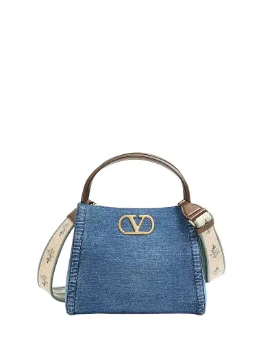 Valentino Garavani Women's Alltime Medium Top Handle Bag in Denim with Embroidered Strap - Denim | Thumbnail 1 Valentino Garavani Women's Alltime Medium Top Handle Bag in Denim with Embroidered Strap - Denim | Thumbnail 1