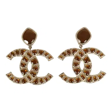 Chanel Chanel Large "Along the Nile" Egypt CC Drop Dangle Clip on Earrings Gold Resin Light | Thumbnail 1 Chanel Chanel Large "Along the Nile" Egypt CC Drop Dangle Clip on Earrings Gold Resin Light | Thumbnail 1
