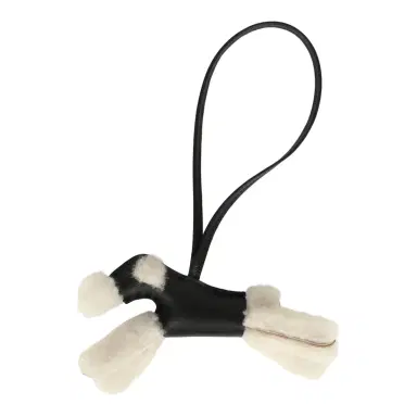 HERMÈS Hermes Budy Charm Black Milo Lambskin and Ecru Merino Sheepskin | Thumbnail 1 HERMÈS Hermes Budy Charm Black Milo Lambskin and Ecru Merino Sheepskin | Thumbnail 1