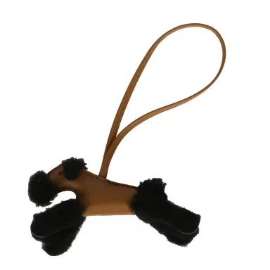 HERMÈS Hermes Budy Charm Kraft and Black Milo Lambskin and Merino Sheepskin | Thumbnail 1 HERMÈS Hermes Budy Charm Kraft and Black Milo Lambskin and Merino Sheepskin | Thumbnail 1